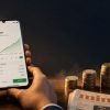 Smartphone showing an SIP mutual fund growth chart beside an ascending stack of Indian rupee coins, editorial finance hero image for LearnFineEdge
