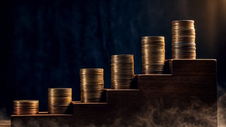 Brass coin staircase ascending diagonally with rupee stacks, illustrating step-up SIP wealth acceleration